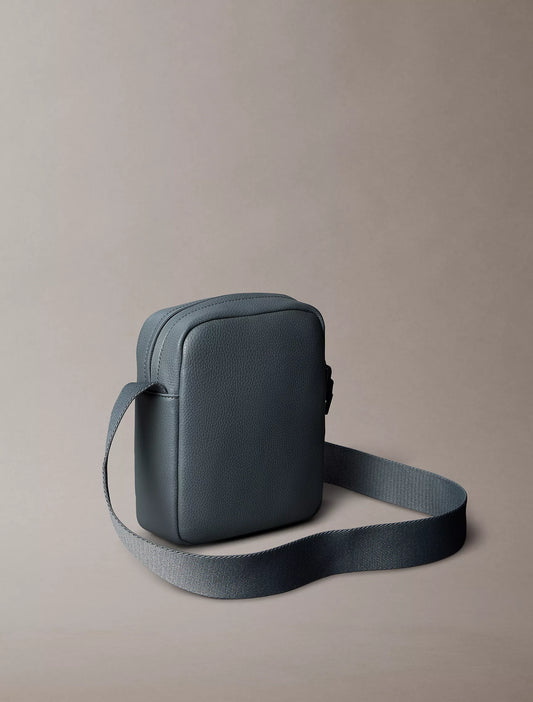 Calvin Klein Pebbled Reporter Bag in Turbulence