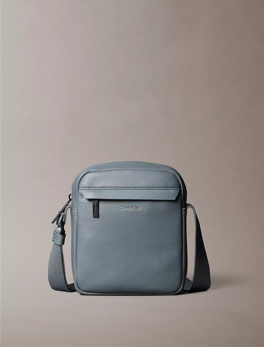 Calvin Klein Pebbled Reporter Bag in Turbulence