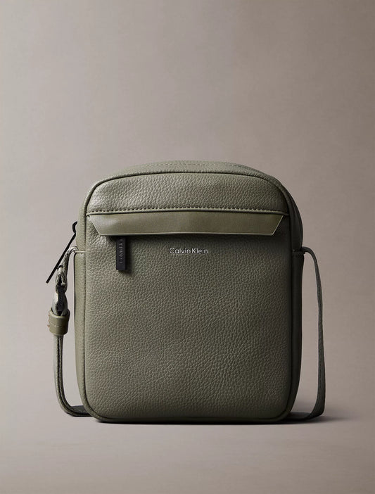Calvin Klein Pebbled Reporter Bag in Deep Lichen Green