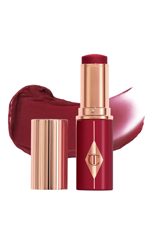 Charlotte Tilbury Unreal Lip + Cheek Glow Blush Stick with Hyaluronic Acid in Berry Glow