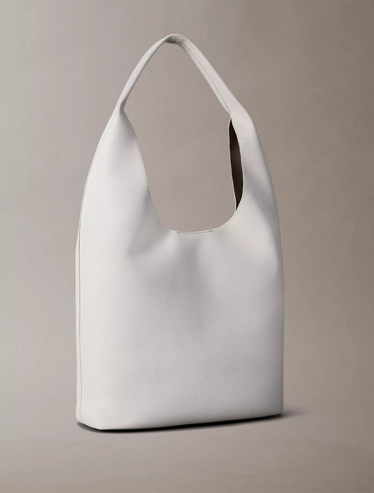 Calvin Klein Pebble Grain Medium Slouchy Bag in White Alyssum
