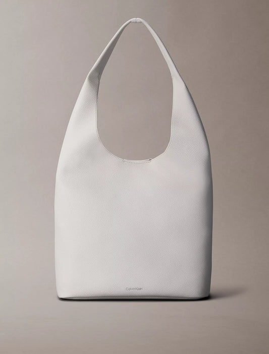 Calvin Klein Pebble Grain Medium Slouchy Bag in White Alyssum