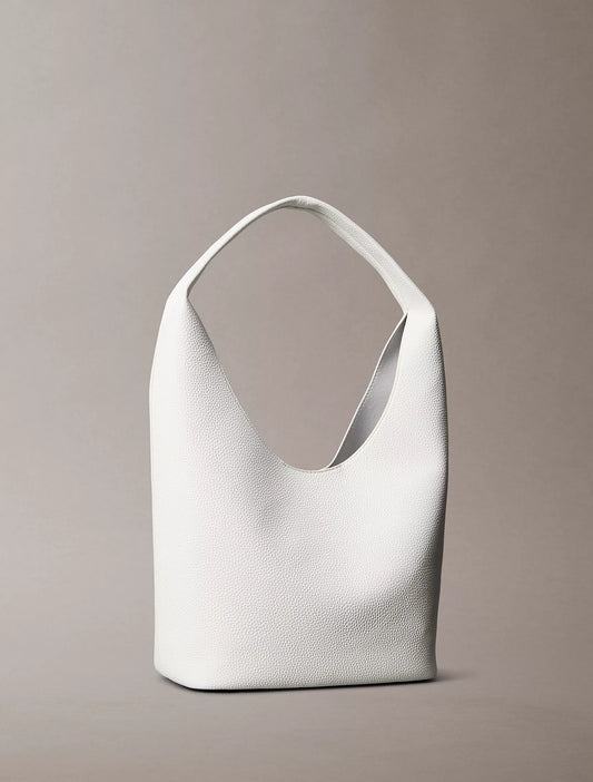 Calvin Klein Pebble Grain Slouchy Bag in White Alyssum