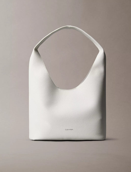 Calvin Klein Pebble Grain Slouchy Bag in White Alyssum