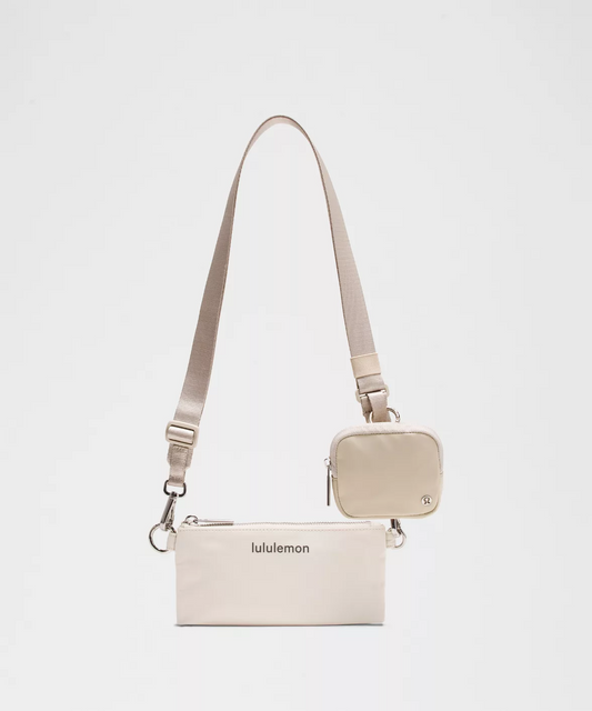 Lululemon Dual-Pouch Sling Bag in Color Raw Linen/Bone